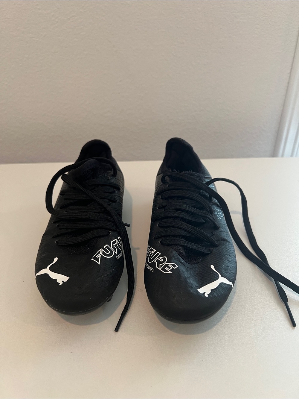 Puma Men’s Black Athletic Soccer Shoes with White Puma Logos